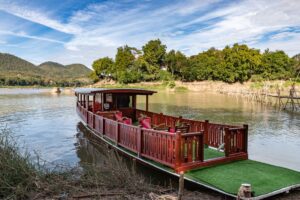 Romantic Sunset or relaxing Afternoon Cruise on the Mekong with the luxurious boat of Mekong Riverview Hotel Luang Prabang, Laos.